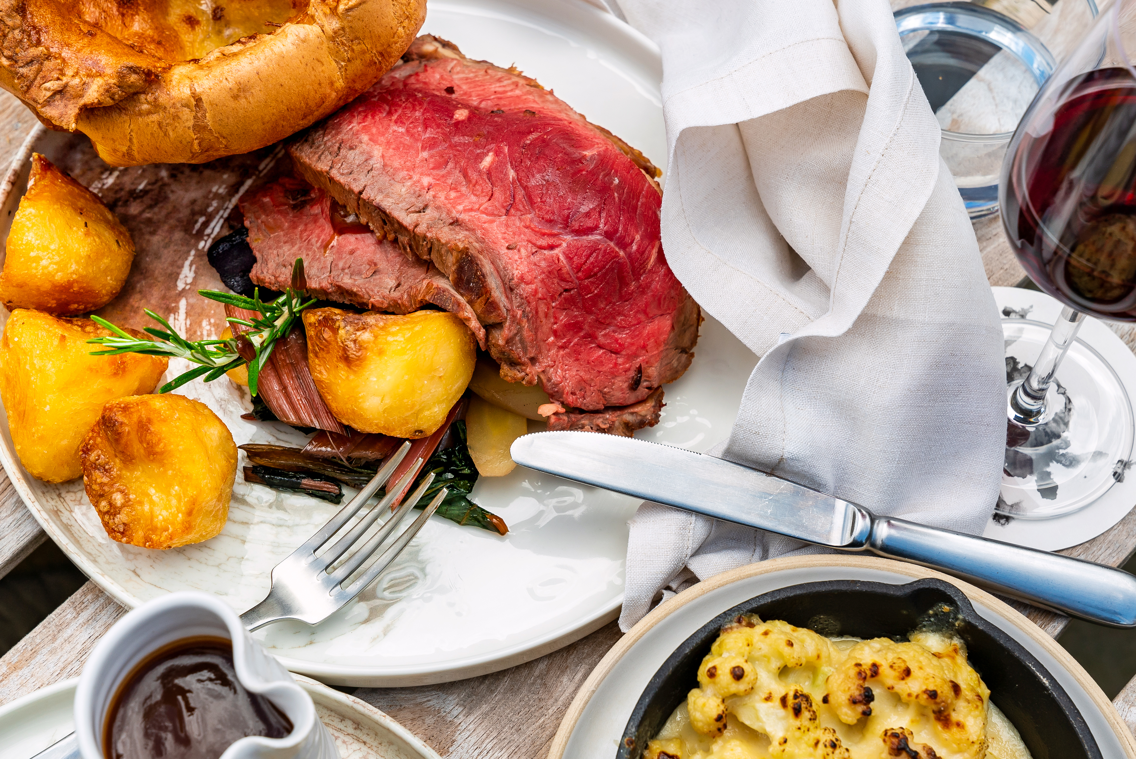 Roast beef with Yorkshire pudding, roast potatoes and cauliflower cheese at the Bull