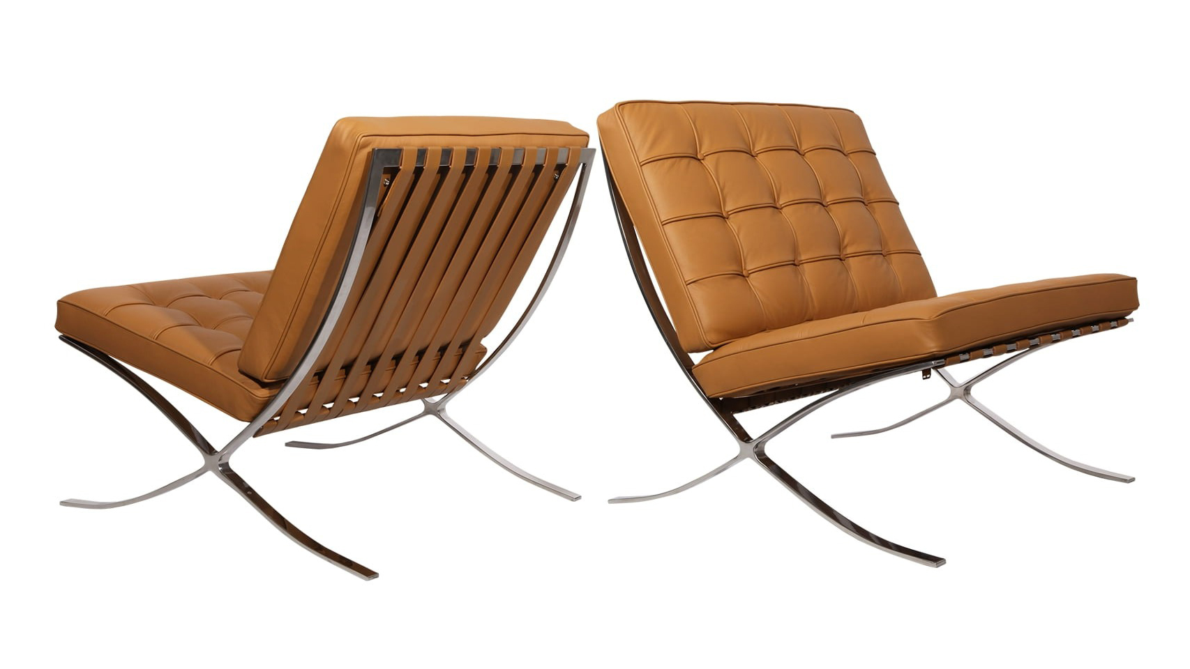 Two tan leather lounge chairs with chrome legs.