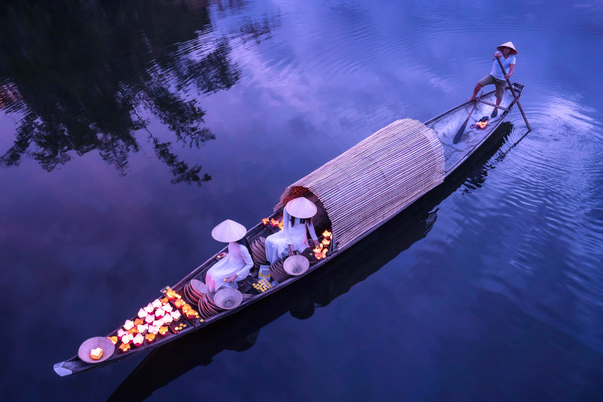 A picturesque boat on the river at Hue, Vietnam, a destination for cultural experiences in July.