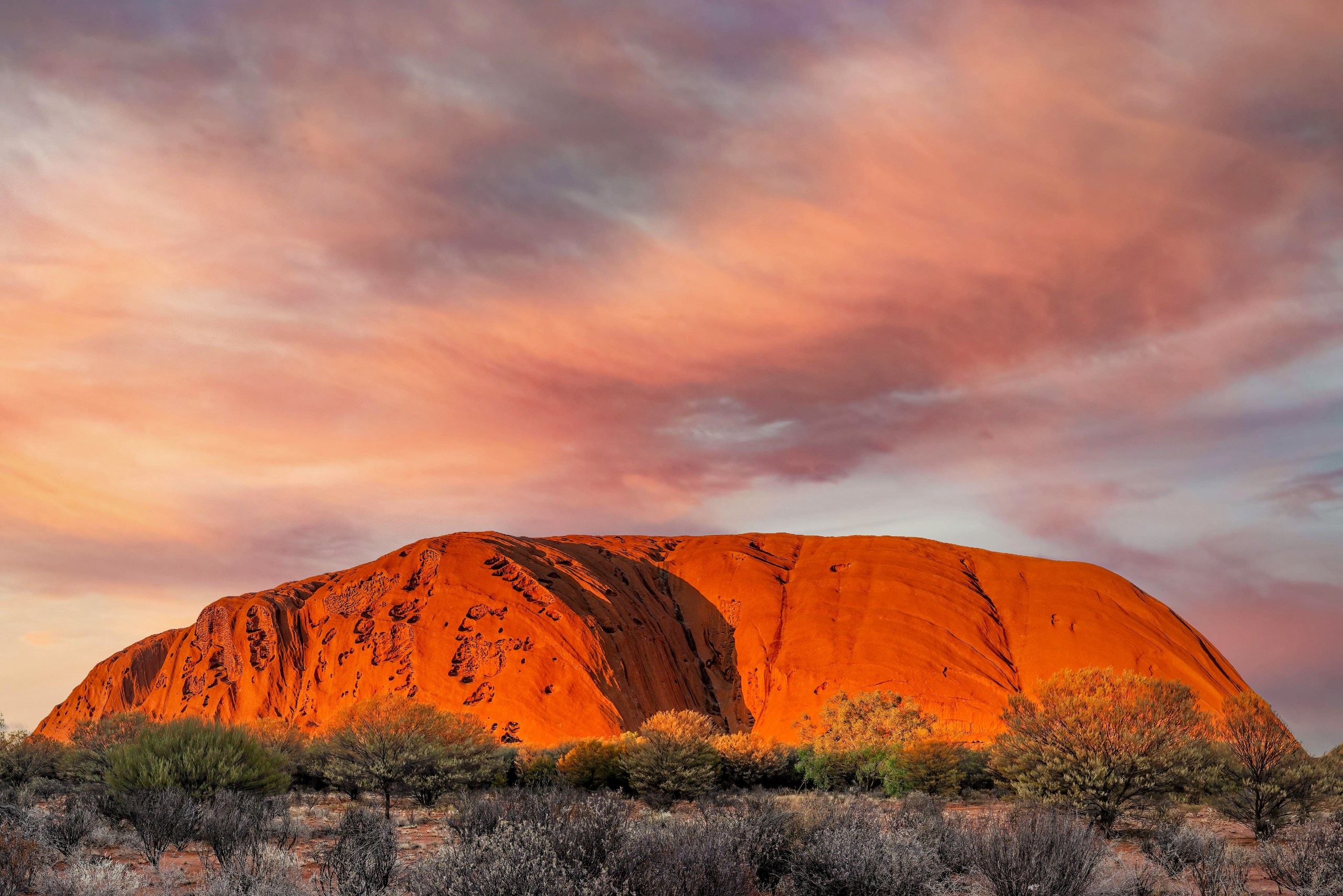 Uluru, Australia, a prime destination for underwater adventures in July.